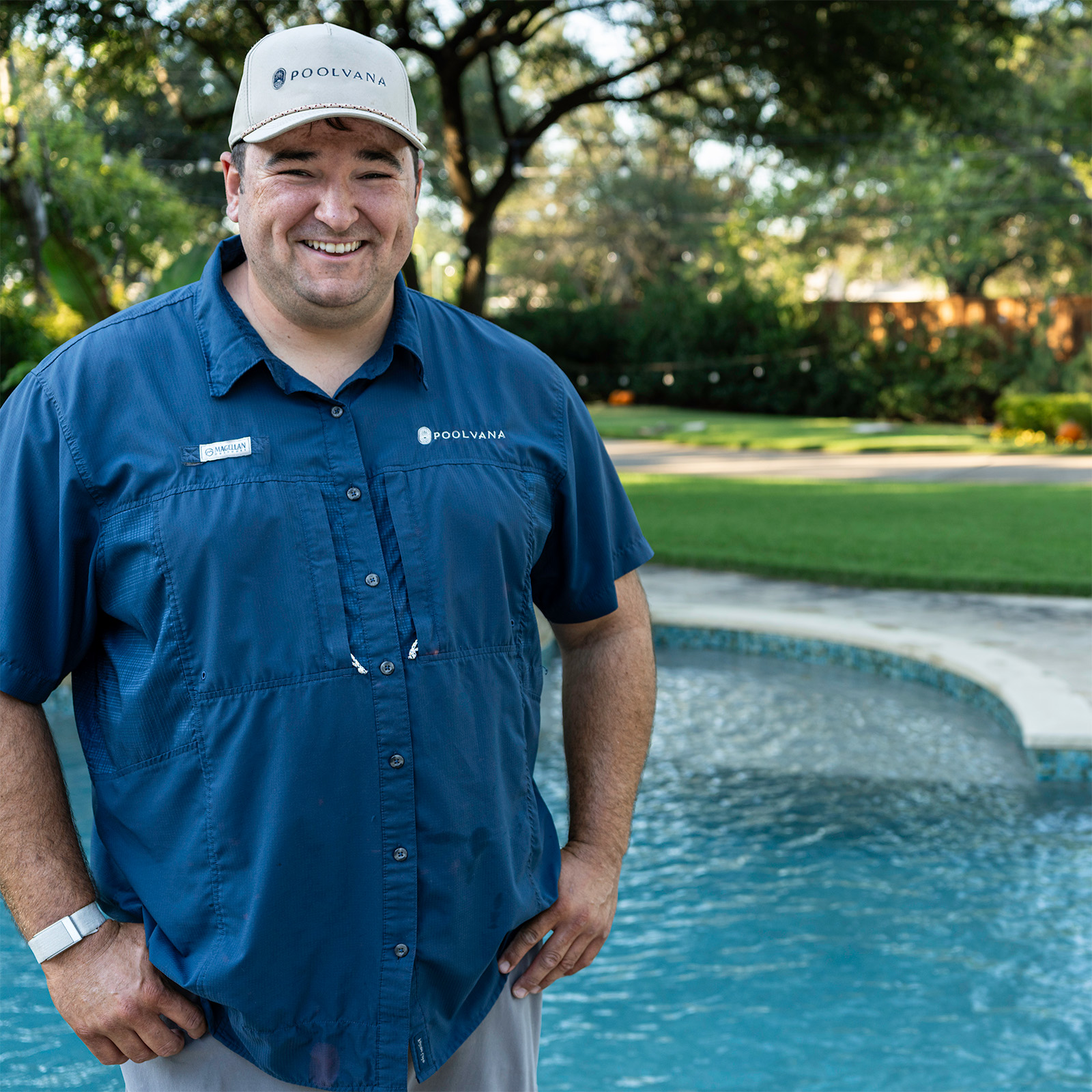 Tanner standing beside a pool
